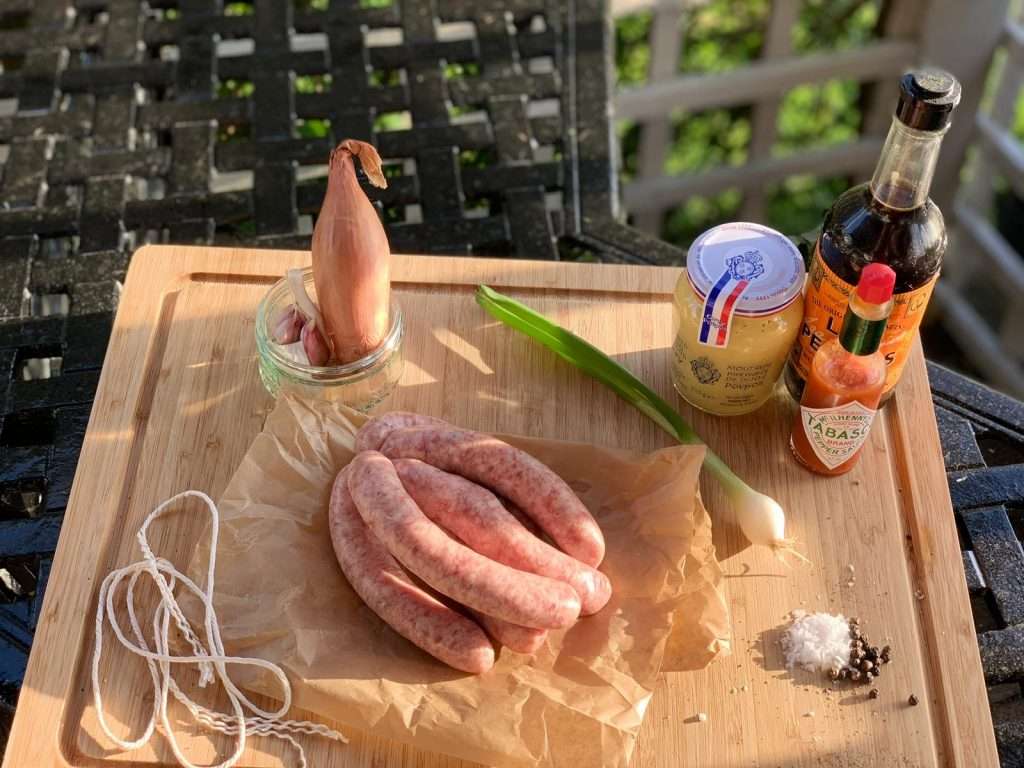 An image of a 6 pack of caramelised onion heritage pork sausages