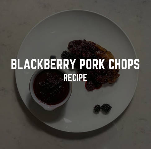An image of blackberry pork chops on a plate with the text "Blackberry Pork Chops Recipe"